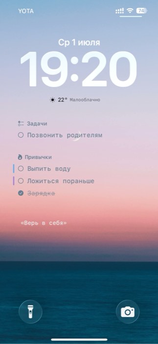iPhone lock screen showing today's tasks on the wallpaper